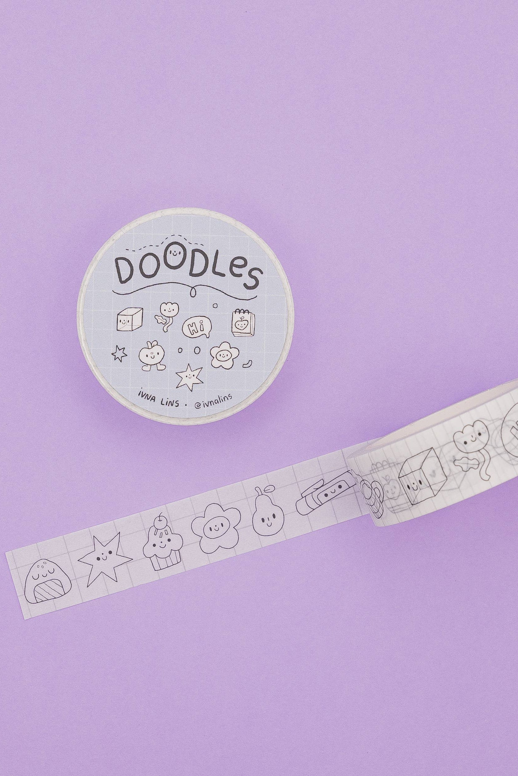 Decorative tape with doodles and a circular container labeled 'DOODLES' on a purple background